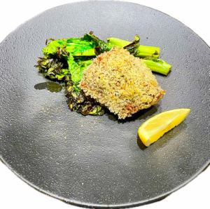 Herb-breaded lamb rump with grilled rape blossoms