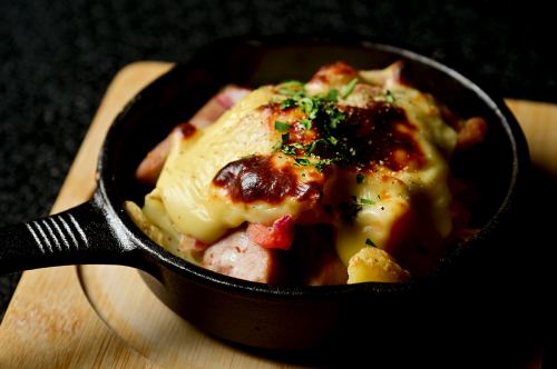 Oven-baked fresh frankfurter and raclette cheese
