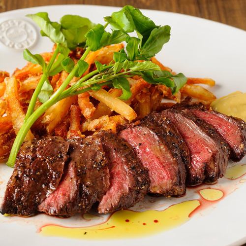 Beef skirt steak with arugula salad, shallots and yuzu mustard