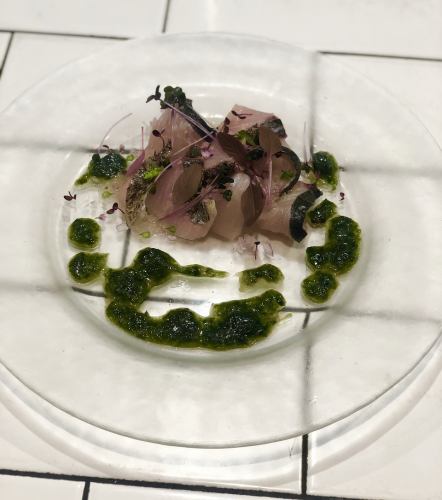 Red sea bream carpaccio with white wine and seaweed vinaigrette