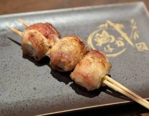 Quail egg wrapped in meat