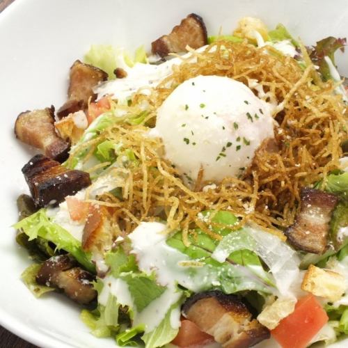 Caesar salad of Iberian pork bacon and hot spring egg