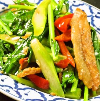 Stir-fried kairan choy and crispy pork with spicy oyster sauce