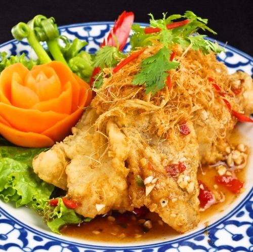 Sauteed fried white fish topped with lemongrass
