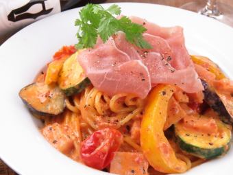 Tomato cream pasta with raw ham and seasonal vegetables