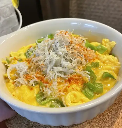 Open omelet with whitebait and extra spicy chili peppers