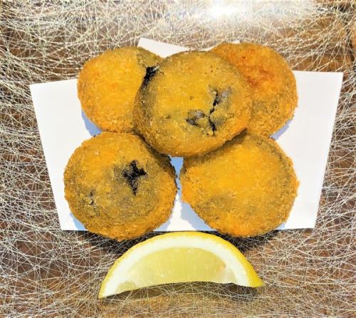 Squid ink risotto croquette
