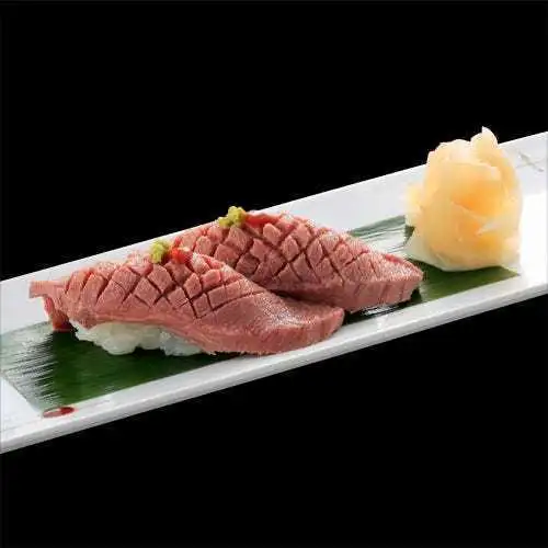 Two pieces of premium roasted beef tongue nigiri sushi