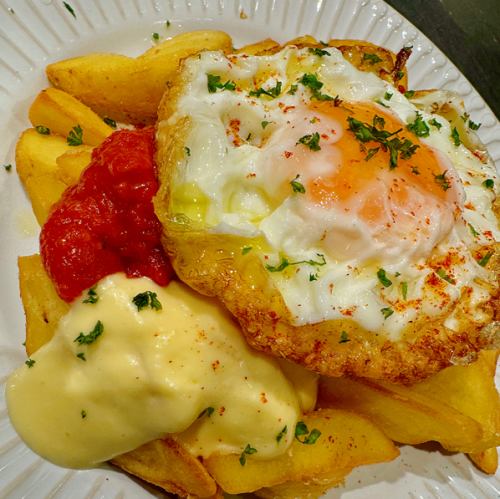 Patatas bravas French fries with spicy tomato sauce