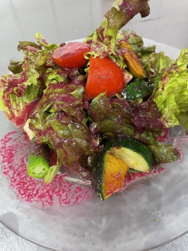 Organic green salad with beet dressing