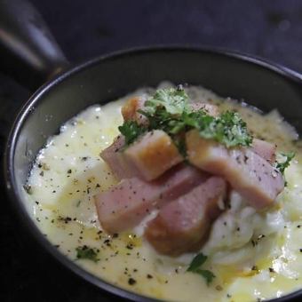 Potato salad bacon drowning in cheese