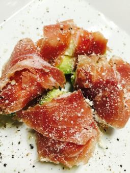Avocado and cheese wrapped in prosciutto