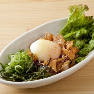 Chicken Yukhoe topped with a soft-boiled egg
