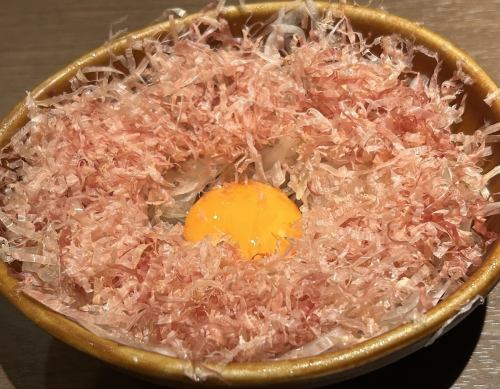 Onion slices topped with egg yolk