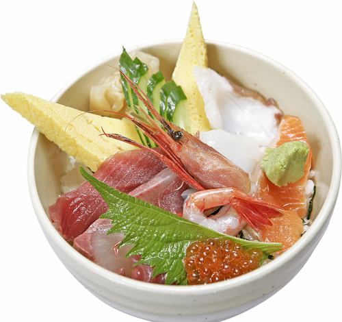 Bowl of rice topped with sashimi