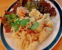 Crispy battered fried squid stir-fried with burnt garlic butter