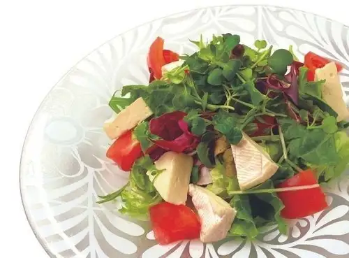 Camembert cheese and fresh tomato Caesar salad