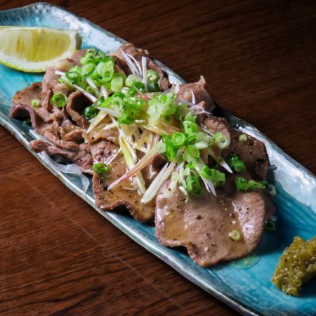 Beef tongue topped with condiments