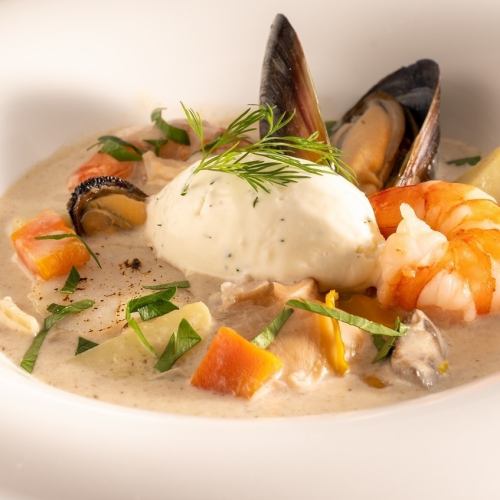 Scallops, mussels, shrimp seafood chowder soup
