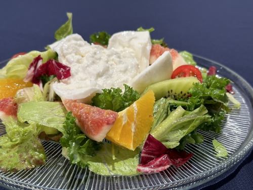 Burrata cheese, fresh fruit and tomato salad