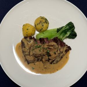 Grilled US beef skirt steak with porcini cream sauce