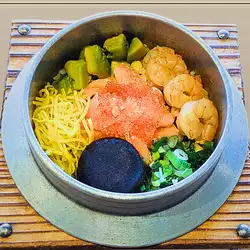 Colorful seafood and avocado rice pot
