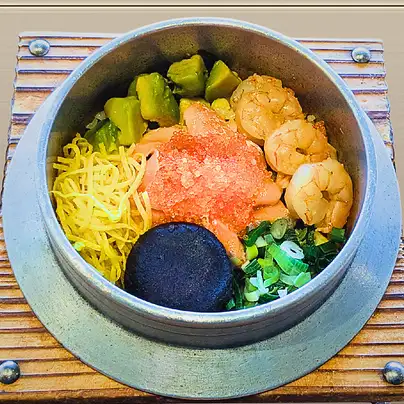 Colorful seafood and avocado rice pot