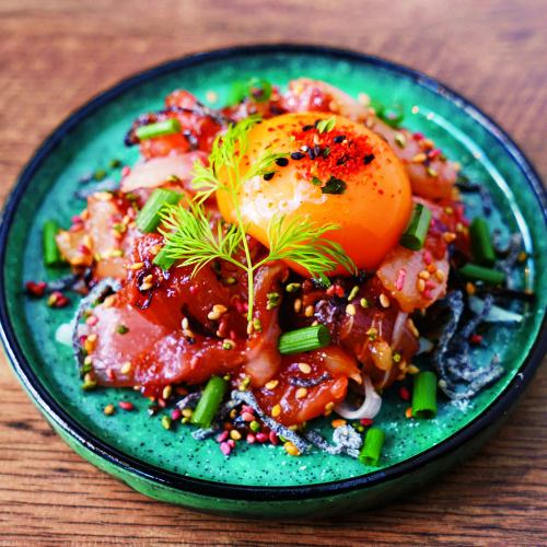 Japanese-style yukhoe (raw beef dish) with fish and salted kelp.