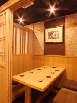 A cozy private room with a small flower pattern that is perfect for a private drinking party