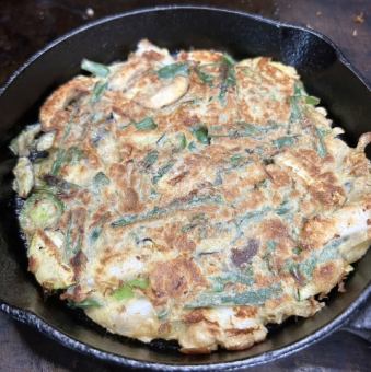 Whimsical vegetable and squid pancake