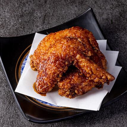 Deep fried chicken wings with delicious spicy Japanese pepper sauce