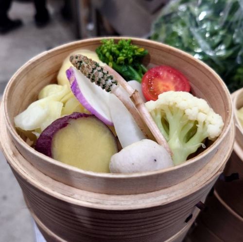 Local vegetables steamed in a bamboo steamer