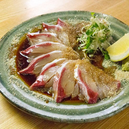 Yellowtail covered with sesame seeds