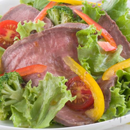 Roast beef colorful salad with wasabi and soy sauce
