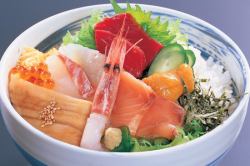 Bowl of rice topped with sashimi