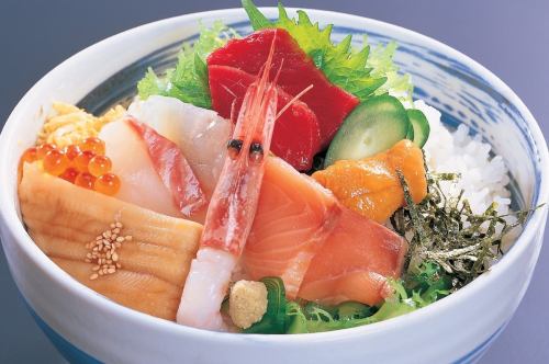 Bowl of rice topped with sashimi