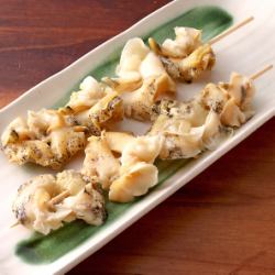 Grilled whelk skewers