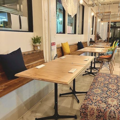 A seating area for four featuring an antique sofa.