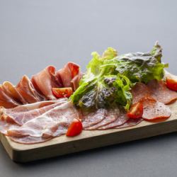 Assortment of raw ham and salami