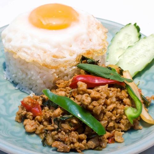 Spicy basil stir-fried minced chicken topped with rice "Gai Gapao Lat Khao"