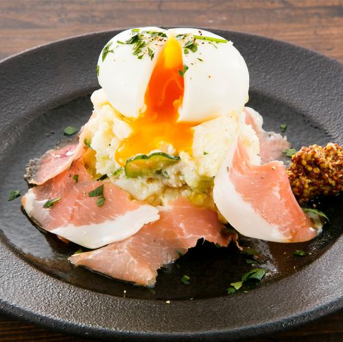 Potato salad topped with prosciutto and soft-boiled egg