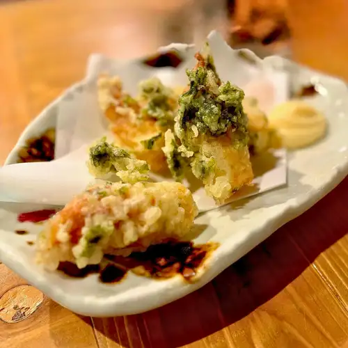 Chikuwa (fish cake) wrapped in seaweed / pickled ginger / mozzarella cheese / bamboo shoots