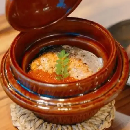 Salmon and salmon roe rice cooked in an earthenware pot