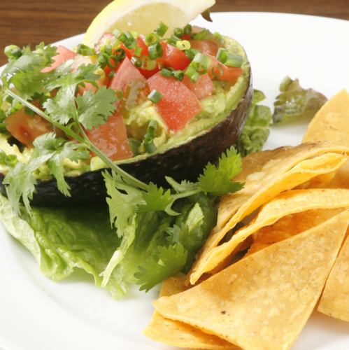 Avocado dip (guacamole) with tortilla chips