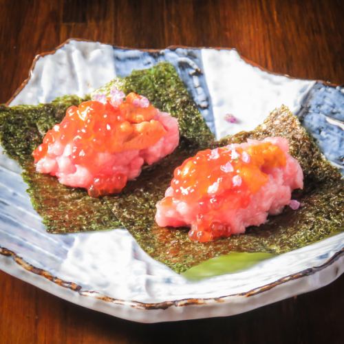 Temaki with fatty tuna, sea urchin, and salmon roe