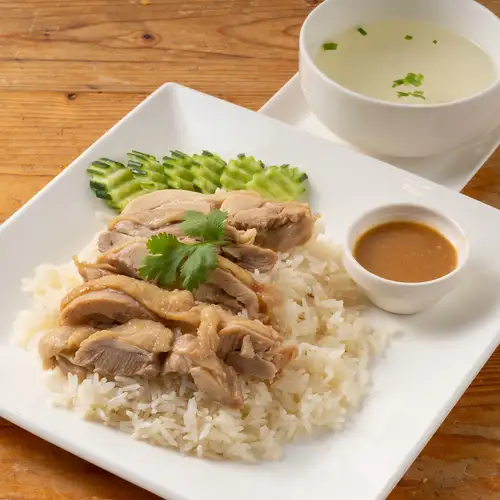 Moist and tender! Authentic Khao Man Gai served with a special sauce.