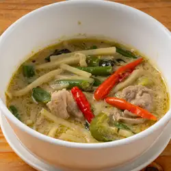 Thai-style green chicken curry with green chilies and herbs