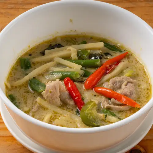 Thai-style green chicken curry with green chilies and herbs