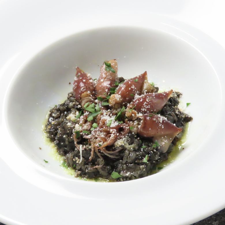 Smoked firefly squid with squid ink risotto