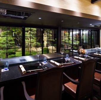 Teppanyaki main dining counter with a view of the Japanese garden